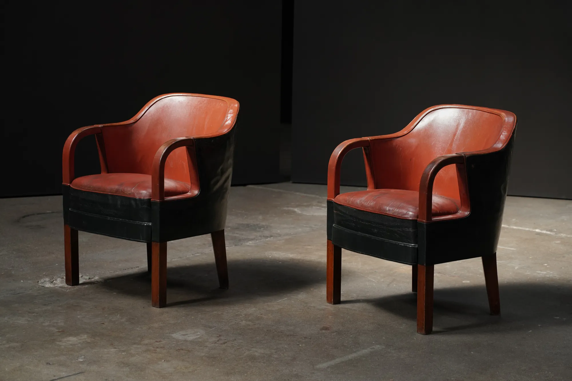 Pair of Leather Silhouette Armchairs